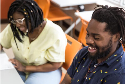 A man and a woman laughing