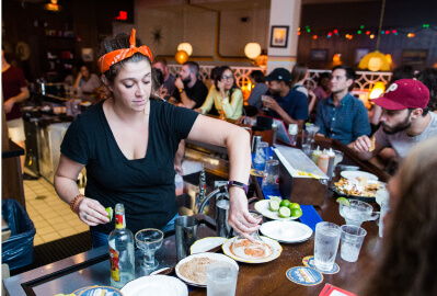 Bartender at work in University City restaurant