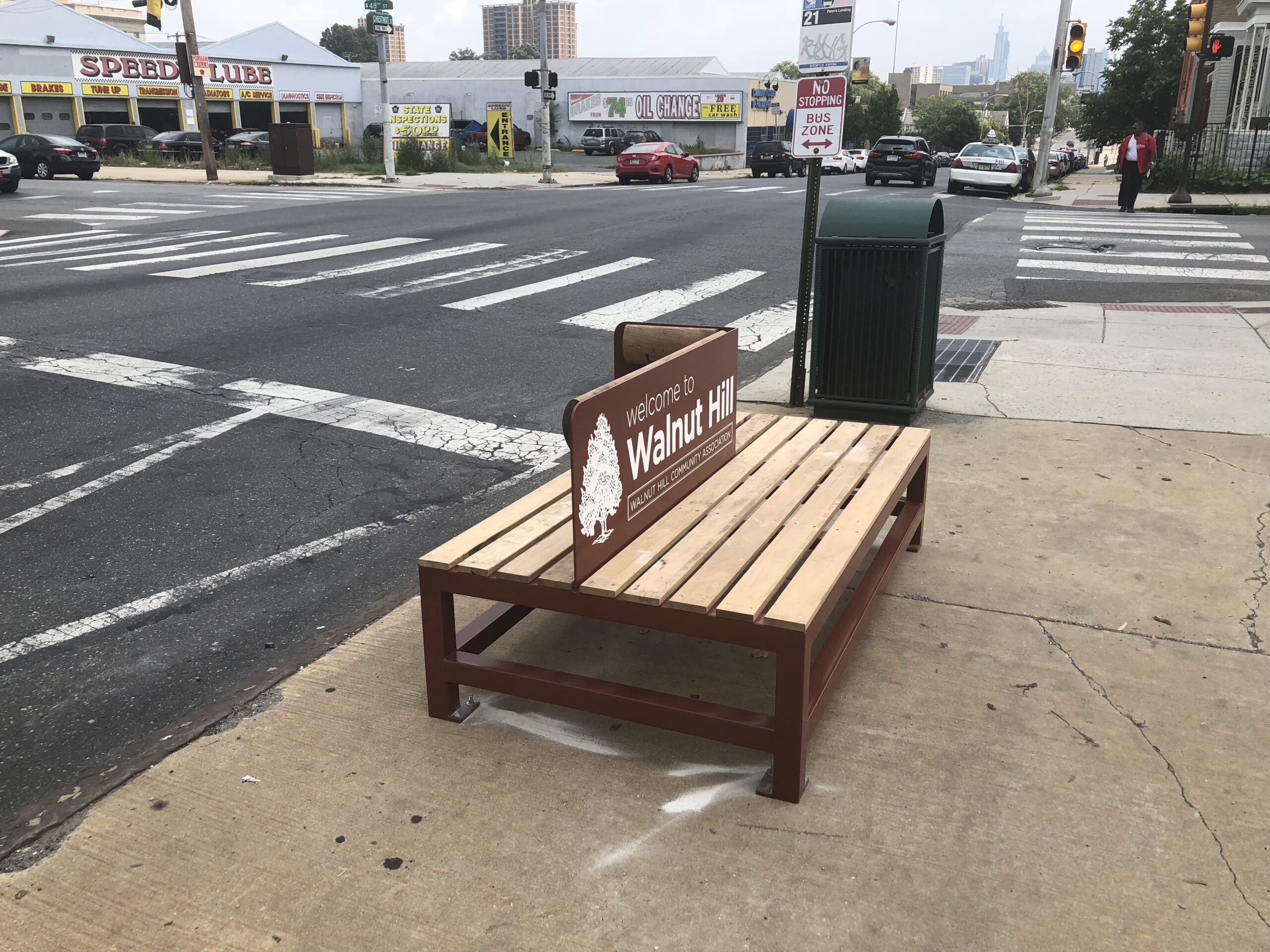 A University City District public bench on a street corner