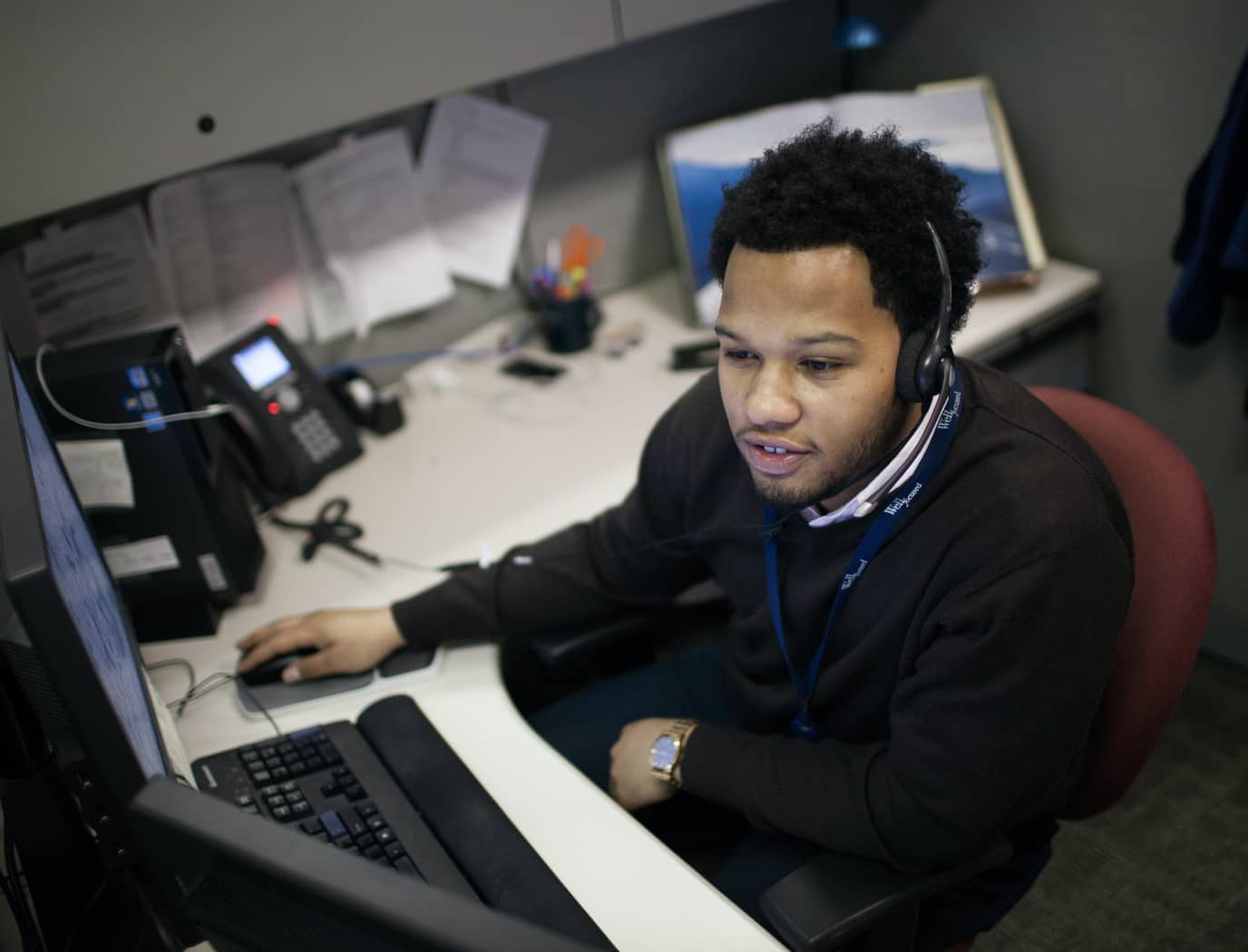 University City District Person Working at Help Desk