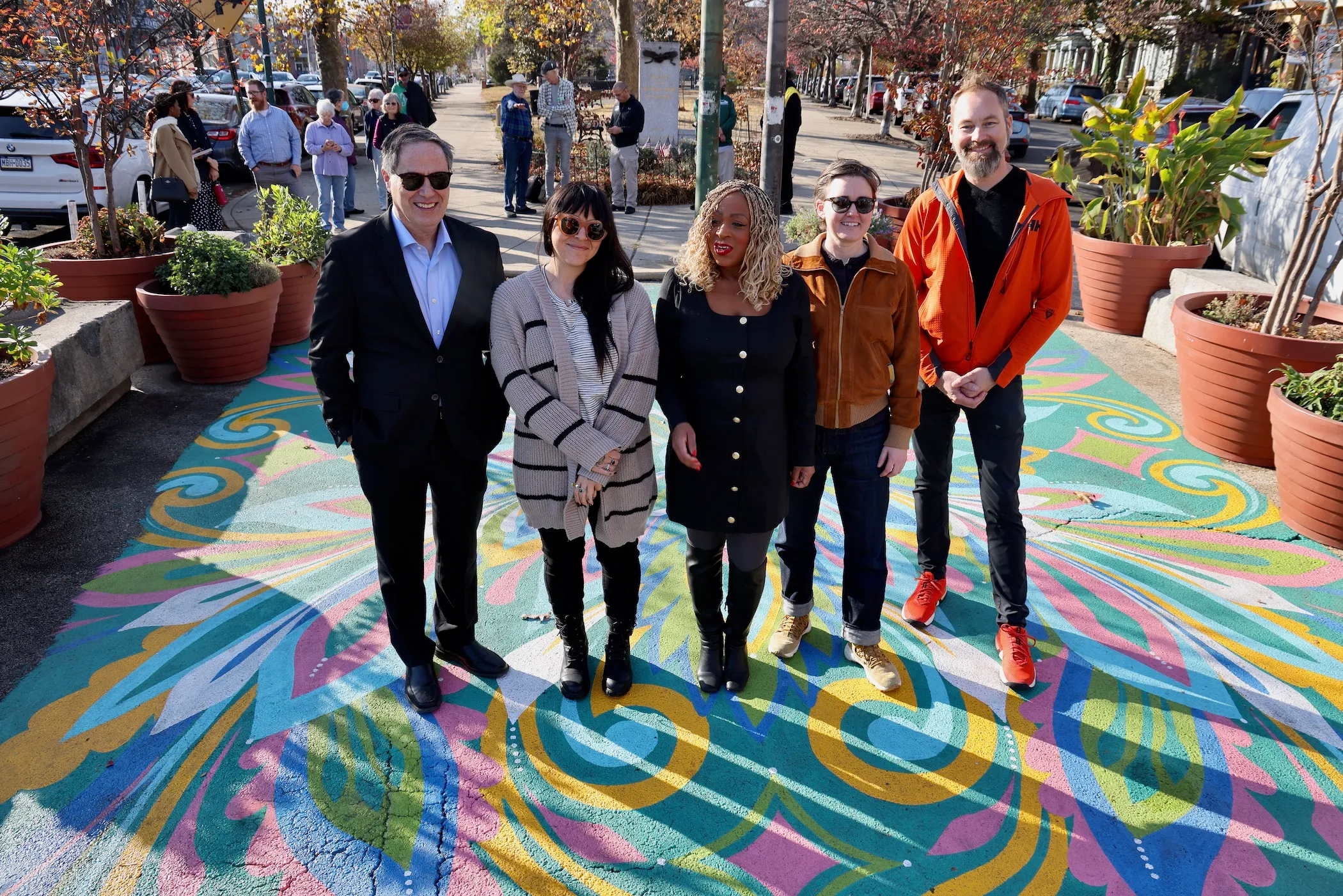 Neighbors come together to celebrate a new ground mural at Cedar Park.