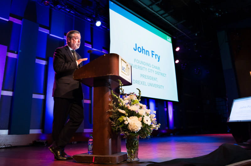 John Fry, President of Drexel University, speaks at the podium of the State Of University City event.