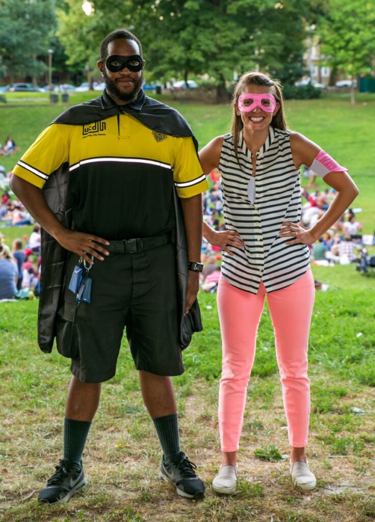 Margaret Starke and a UCD safety ambassador pose dressed as super heroes