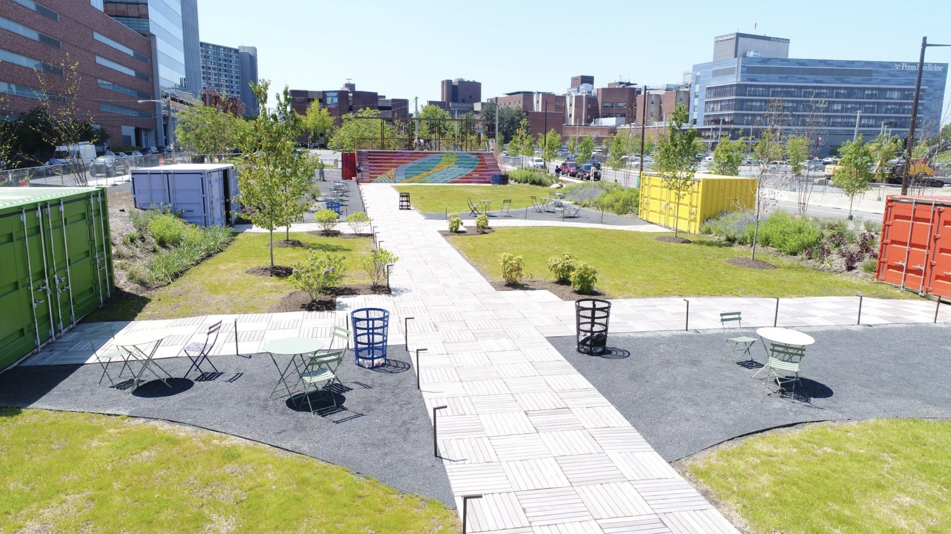 A view of the The Lawn at uCity Square featuring the main. pathway lined with seating