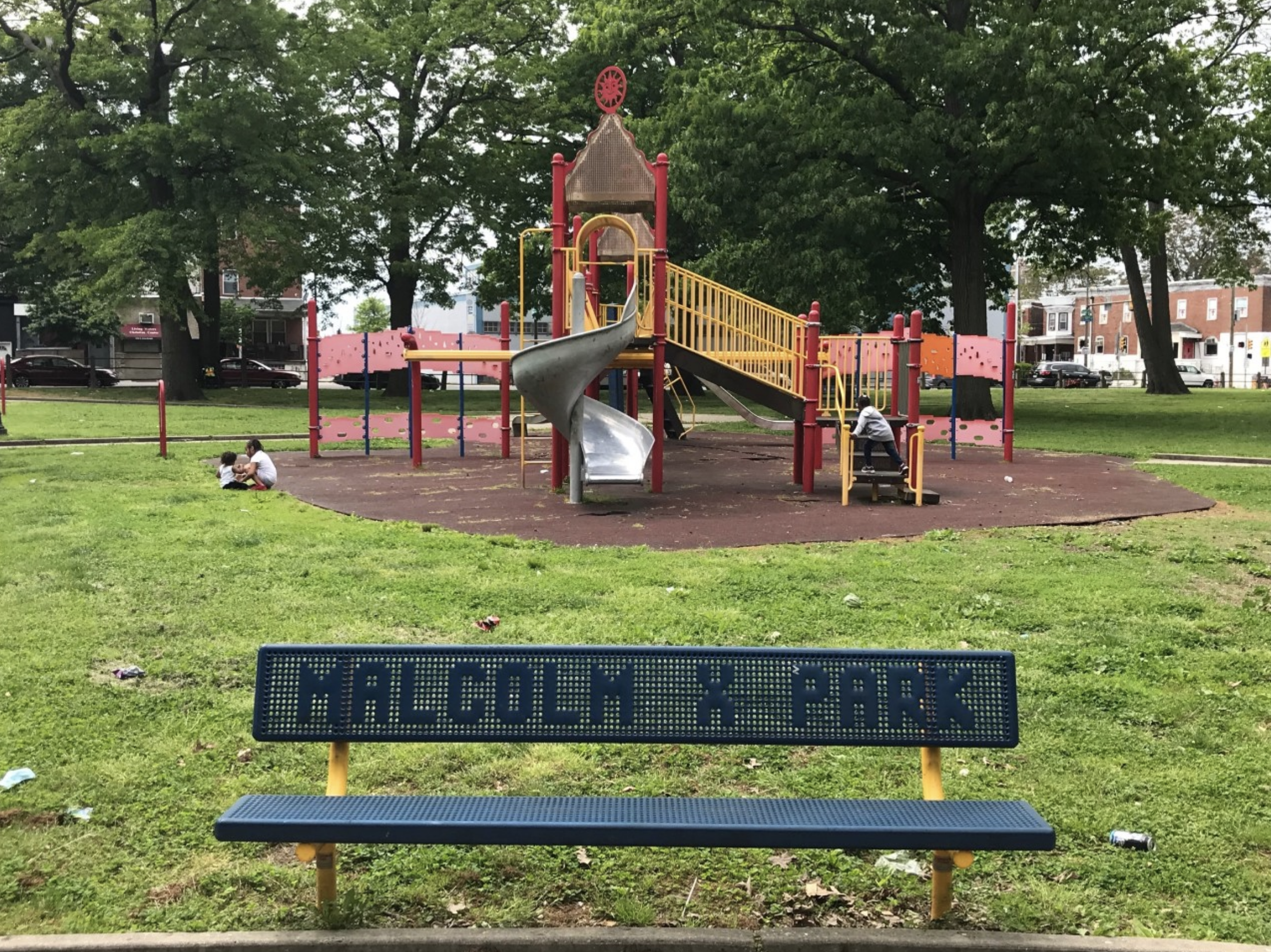 A playground and bench in Malcolm X Park