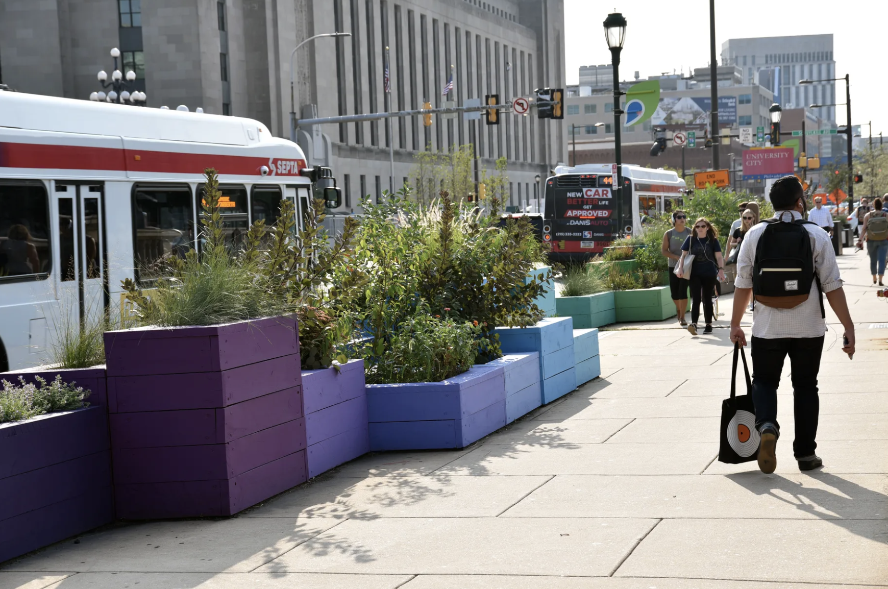 Colorful planters on the sidewalk along the Market Street Bridge.