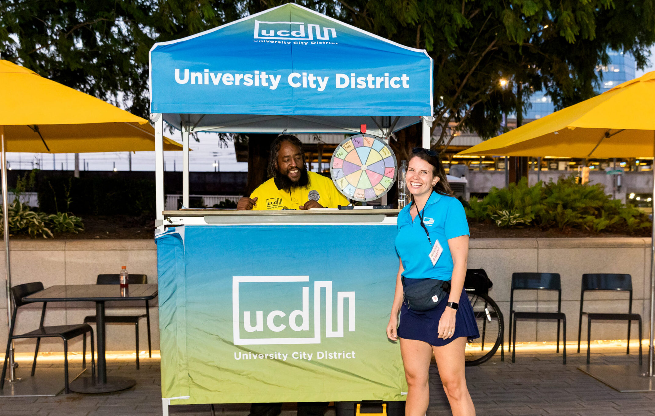 Margaret Stark posing with a UCD Safety Ambassador at the UCD tent during an event