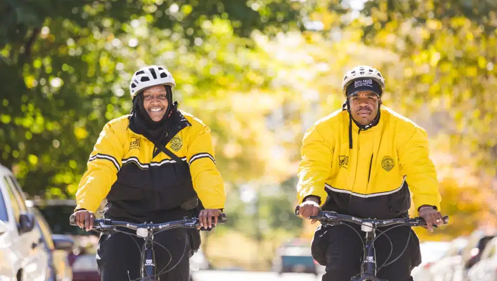 University City District safety ambassadors patrolling the neighborhood on bicycles.