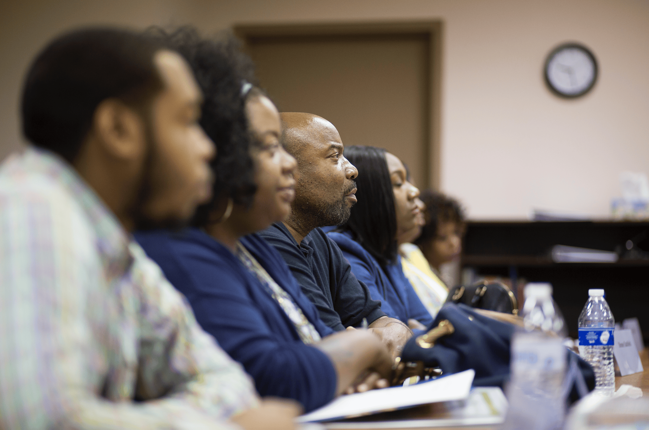 A group of Skills Initiative participants listening intently