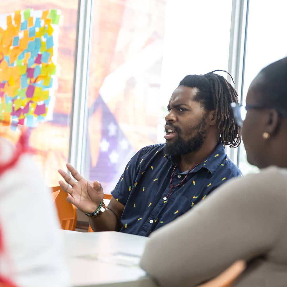 A Skills Initiative participants speaking in a group setting