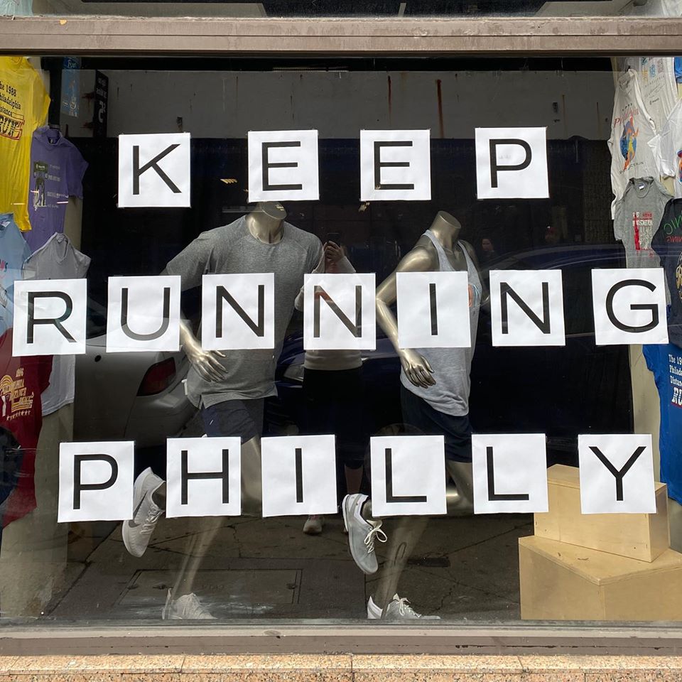 A window display saying "Keep Running Philly"